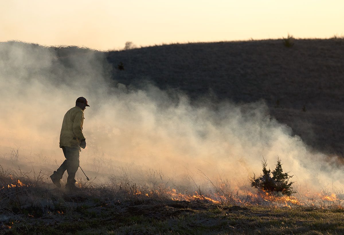 a man starting a line of fire